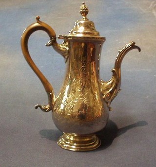 An engraved Queen Anne style silver plated coffee pot with beech  handle