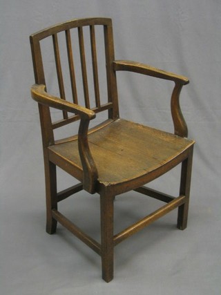 A 19th/20th Century Country beech and mahogany stick and rail back carver chair