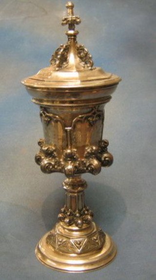 A large and impressive embossed German silver cup and cover with parcel gilt interior, 37 ozs
