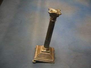 A fluted and reeded Corinthian column candlestick, raised on a stepped base with 3 bun feet (1f) 13"