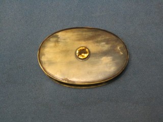 A 19th Century oval horn tobacco or snuff box the lid set a yellow stone 4"