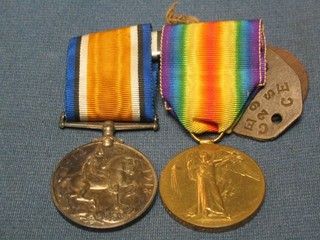 A pair British War medal and Victory medal to 29444 Pte. A C Hoy Somerset Light Infantry together with a pair of dog tags