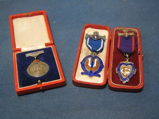 2 silver gilt and enamelled Odd Fellows jewels and a silver gilt and enamelled Woolworths Long Service medal