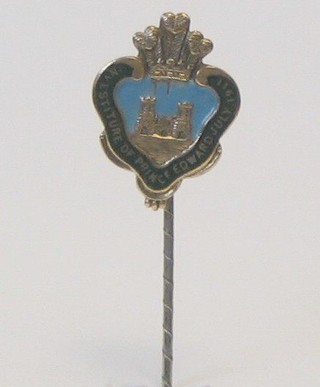 A gilt metal and enamelled stick pin to commemorate the Investiture of Prince Edward Prince of Wales July 1911