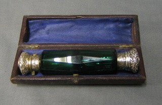 A Victorian veridian coloured glass double ended scent phial with embossed silver plated lids, 5", contained in a original leather box