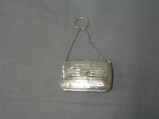 A silver purse with engine turned decoration Birmingham 1915, 3" (some dents)