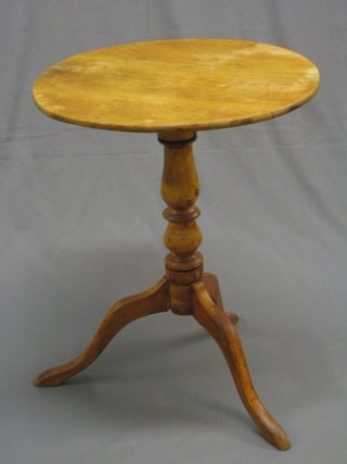 A Victorian mahogany snap top wine table, raised on turned column and tripod supports 21"