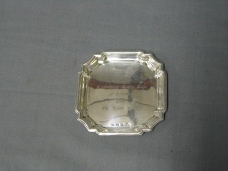 A small silver salver with bracketed border, London 1932, by the Goldsmiths and Silversmiths Co. 3 1/2"