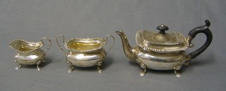 An Edwardian silver 3 piece bachelor's tea service with teapot, twin handled sugar bowl and cream jug, Sheffield 1901, 15 ozs