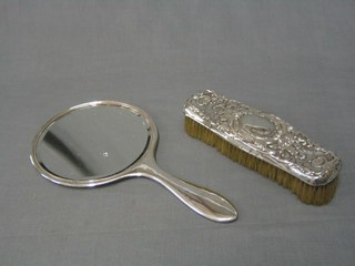 A plain silver hand mirror Birmingham 1915 with an embossed silver clothes brush