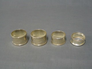 4 various silver napkin rings
