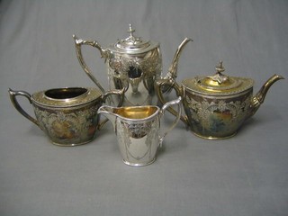 An engraved Britannia metal 4 piece tea/coffee service with coffee pot, teapot, twin handled sugar bowl and cream jug