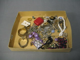 An RAF cap badge and a collection of costume jewellery