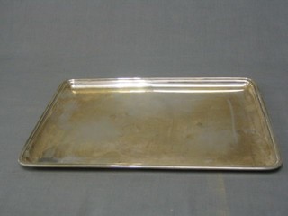 A rectangular silver dressing table tray, Birmingham 1918 by the Goldsmiths & Silversmiths Co. 10 ozs