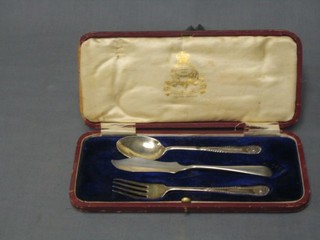 A 2 piece silver christening set and a silver butter knife, cased