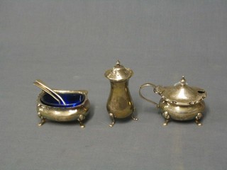 A silver mustard pot, Chester and a silver salt and pepper