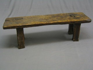 A well weathered rectangular oak pig bench, raised on square supports 58"