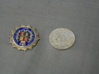 A Victorian silver  and enamelled half crown brooch, a brass token marked Abysinia 1907, a 1964 Kennedy half dollar, a 2000 1 dollar piece and an aluminium Edward VII Coronation medal