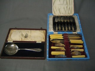 A cased set of 6 fish knives and forks, a silver plated serving spoon and a set of 6 pastry forks, all cased