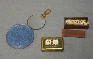 24 miniature wooden dominoes, cased, a pocket magnifying glass and a pressed metal vesta case decorated Princess Royal