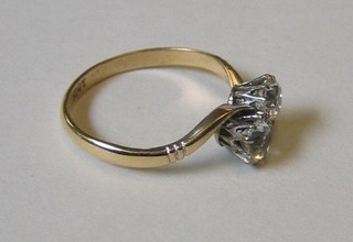 A lady's 18ct gold dress ring set 2 diamonds