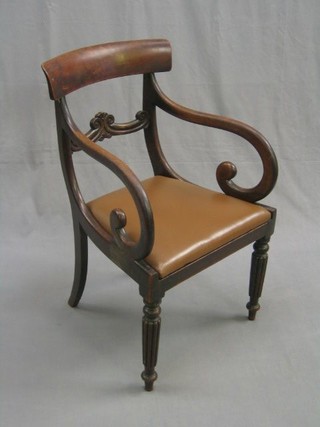 A William IV mahogany bar back desk chair with carved mid rail and upholstered drop in seat, raised on turned and reeded supports