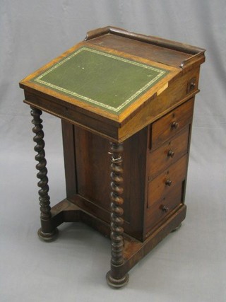 An early Victorian rosewood Davenport desk with three-quarter gallery, fitted an inkwell, the pedestal fitted 4 long drawers, raised on spiral turned supports 19"