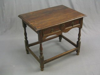 A 17th/18th Century oak low boy fitted a drawer raised on turned and block supports 33"