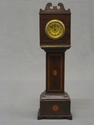 A miniature reproduction longcase clock with gilt dial and Arabic numerals contained in a mahogany case (f)