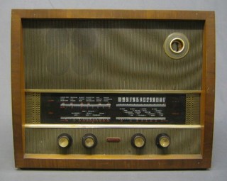 A Murphy type A242 radio contained in a walnutwood case with magic eye
