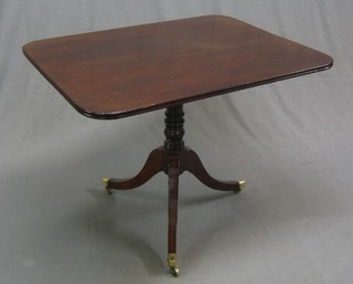 A Regency rectangular snap top breakfast table, raised on a gun barrel turned column with tripod supports ending in brass caps and castors, 37"