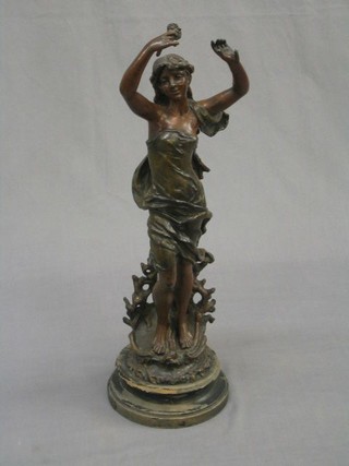 A French spelter figure of a standing lady raised on a socle base 18"