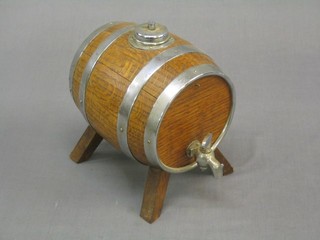 A small coopered oak spirit barrel with chromium plated mounts 7"