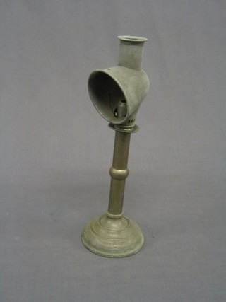 A 19th Century polished metal sprung loaded anglepoise candle