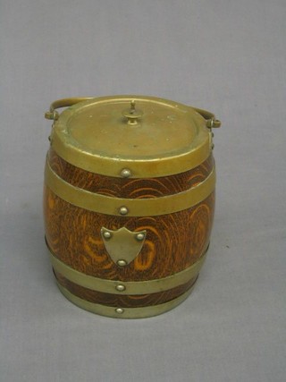 A turned oak biscuit barrel with silver plated mounts
