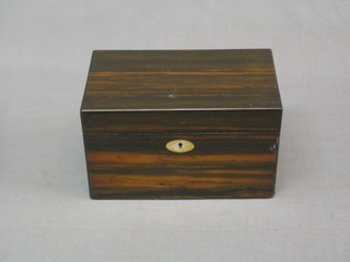 A Victorian Coromandel rectangular tea caddy with hinged lid and mother of pearl escutcheon, the interior fitted 1 caddy, 10"