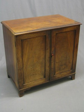 A Victorian mahogany linen press, the interior fitted 4 trays enclosed by panelled doors, raised on bracket feet 35"
