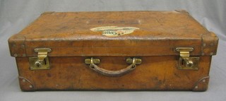 A Drew & Co leather suitcase with brass fittings and Cunard Aquitania label (label partially damaged)