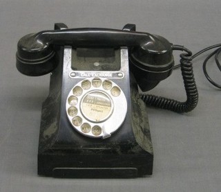 An old black Bakelite dial telephone