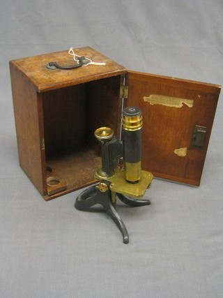 A brass single draw microscope with carrying case (incomplete)