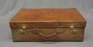 A leather suitcase with brass mounts decorated the Crest of the Isle of Man