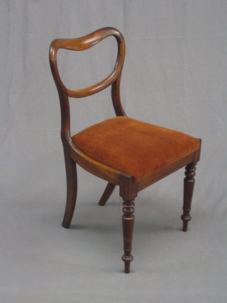 A Victorian rosewood spoon back dining chair with upholstered seat of serpentine outline