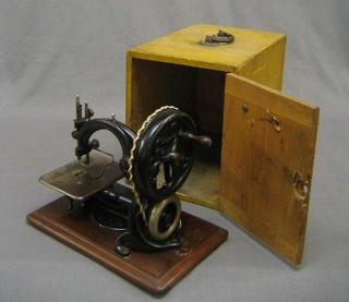 A Wilcox & Gibbs sewing machine, boxed