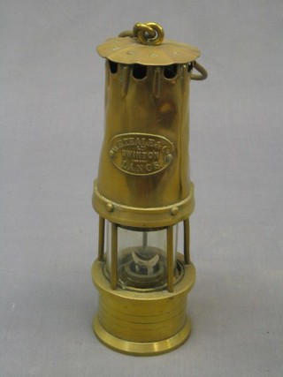 A miner's safety lamp by W E Tale & Co of Swinton Lancs