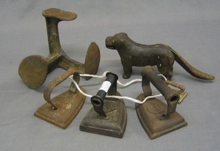 A pair of nut crackers in the form of a Labrador, a cobblers last and 4 flat irons