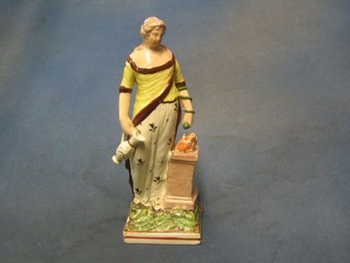 An 18th Century Staffordshire figure of a standing classical lady (r) 9"
