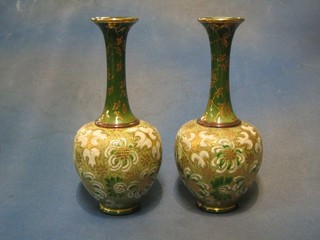 A pair of Royal Doulton, Doulton & Slater pattern green glazed club shaped vases with gilt decoration, bases marked Royal Doulton and impressed 957 11"