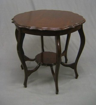 A circular Edwardian mahogany 2 tier occasional table raised on cabriole supports 30"