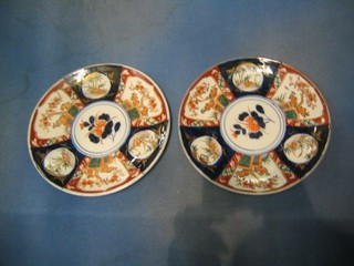 A pair of Japanese late Imari porcelain plates with panel and floral decoration 10"