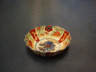 A 19th Century Japanese Imari porcelain bowl with panel decoration and lobed body 6 1/2"